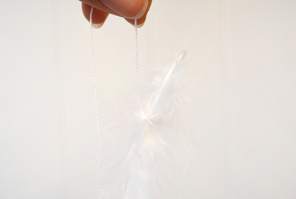 wrap feathers in string for mobile
