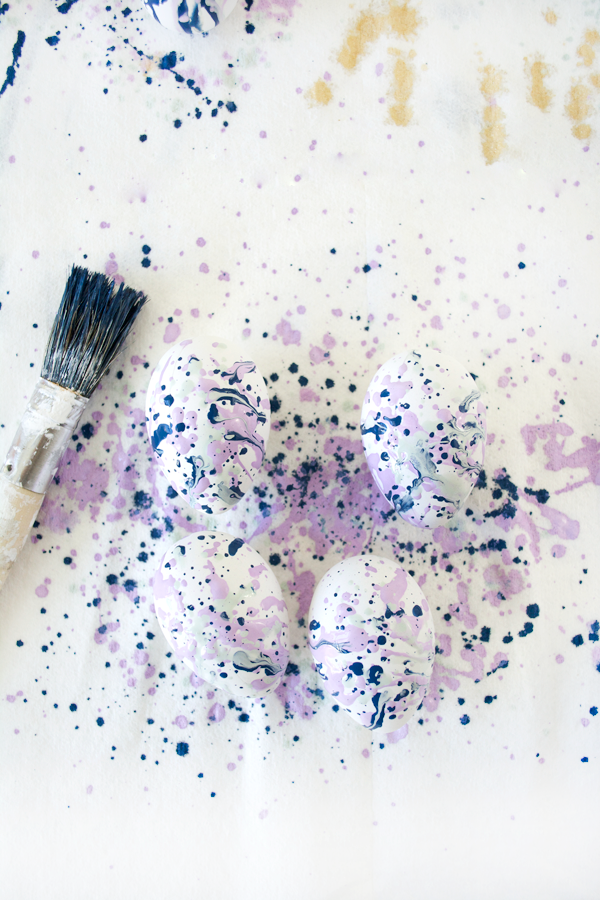purple and blue splatter paint easter eggs