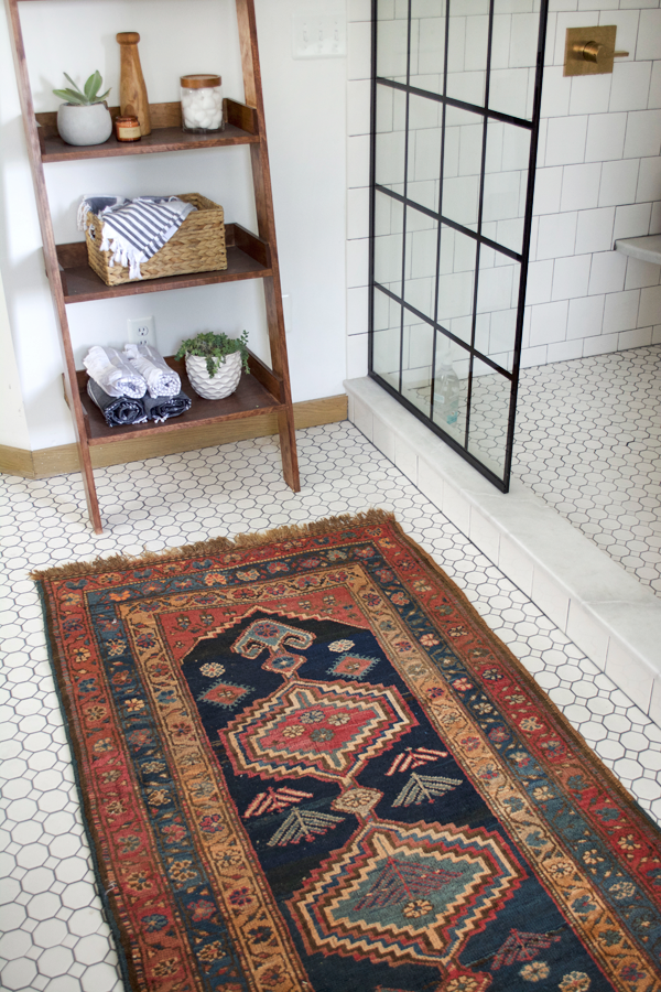 vintage rug next to the shower