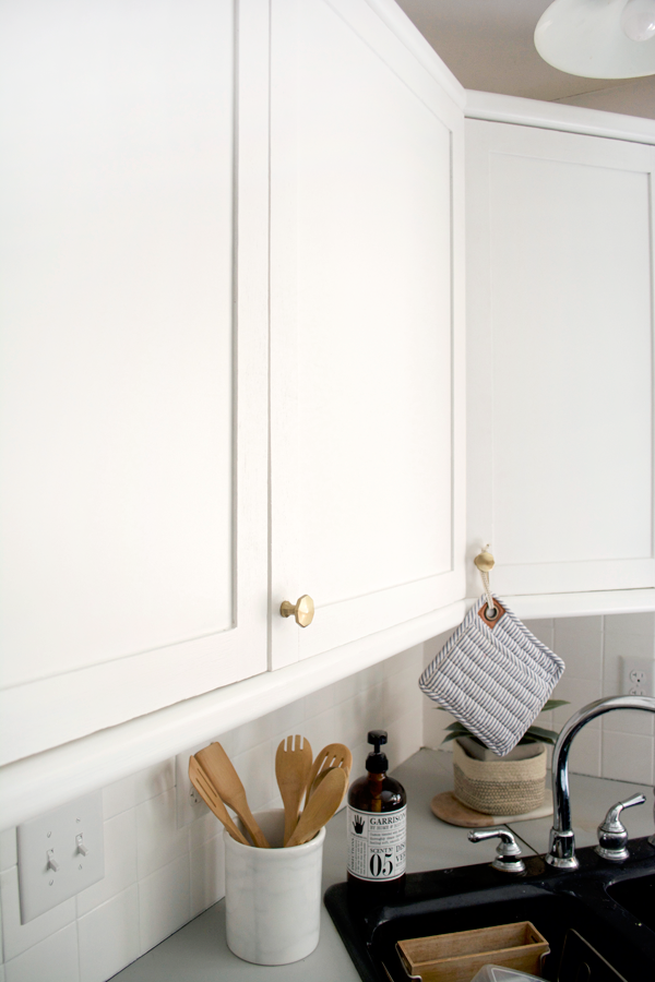adding trim to your cabinets to achieve shaker style