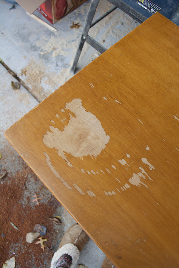 chipping veneer on a piece of old furniture