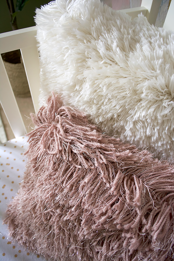 Faux Fur Pillows in a little girl's nursery reveal