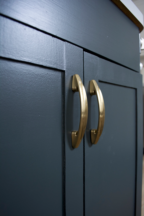 Dark Blue Kitchen Cabinets with Brass Hardware
