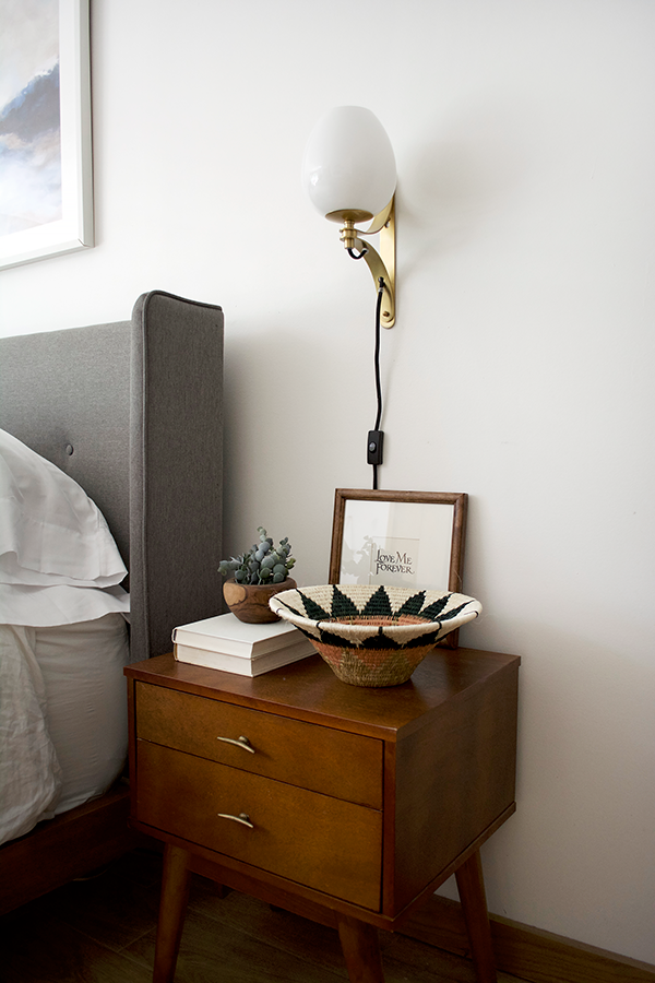 Nightstand decor in a modern master bedroom